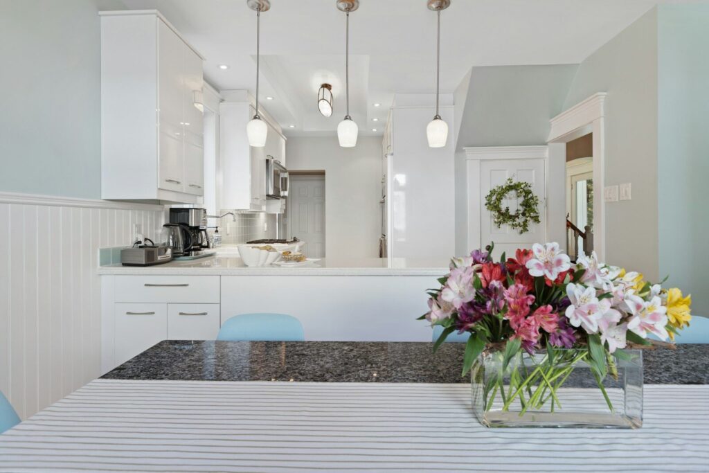 Home That Feels Peaceful Every Day; a vase filled with flowers sitting on top of a table
